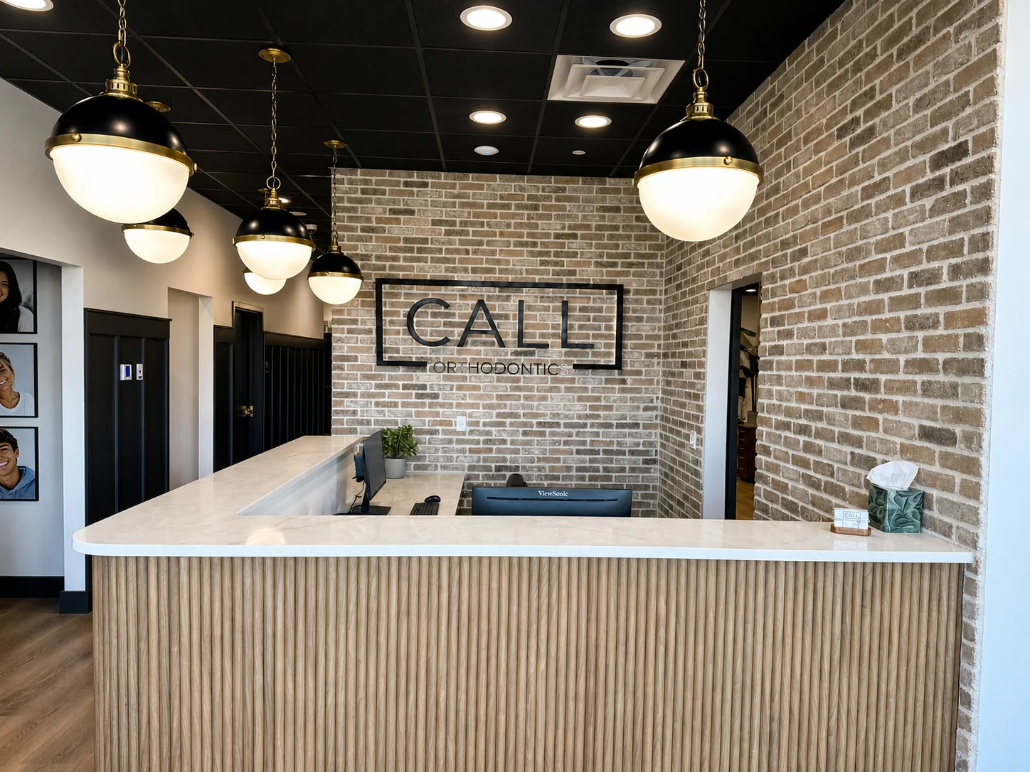 Finished Call Orthodontics reception desk with integrated front-office technology